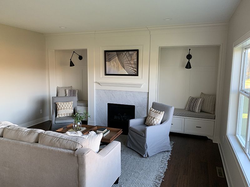 living area with custom fireplace mantel and side seating areas